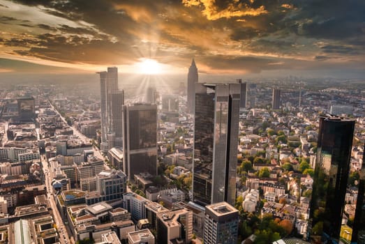 Frankfurt Skyline at sunset with sun flare skyscraper bank office buildings