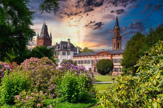 Weinheim castle park Old Town view during sunset with sun flare, hessen, germany
