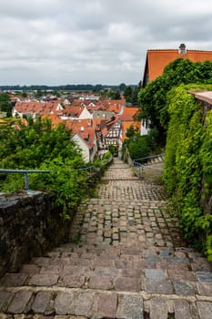 Old stairs in Zwingenberg Cityscape with roofs of old town during a cloudy day