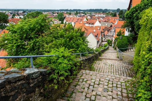 Old stairs in Zwingenberg Cityscape with roofs of old town during a cloudy day
