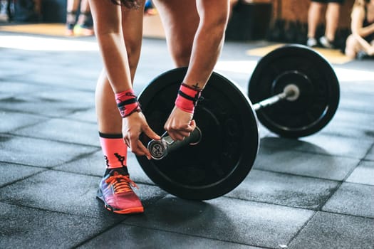 a crossfit athlete performing exercise in gym
