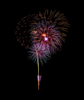 Beautiful colorful fireworks exploding in the night sky, isolated on black background. New year and anniversary concept.