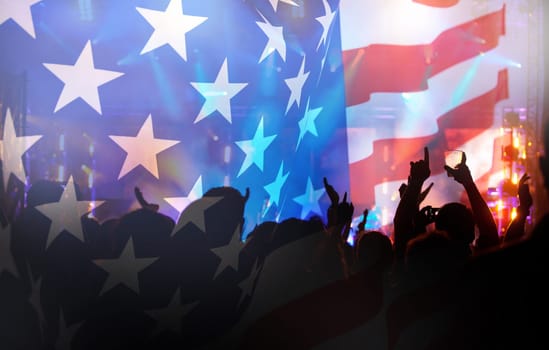 Crowd of people celebrating Independence Day. United States of America USA flag with fireworks background for 4th of July.