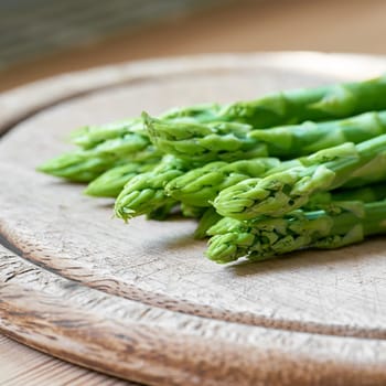 fresh green asparagus from an asparagus field as an ingredient in a kitchen