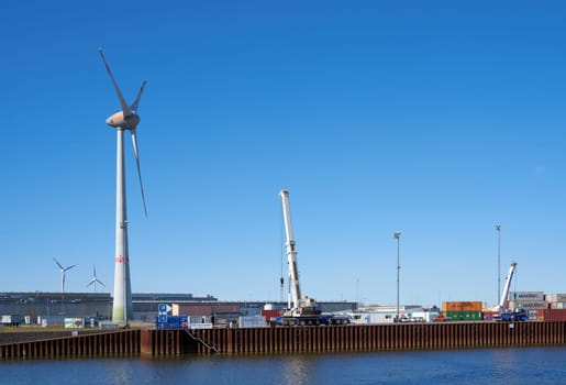 Commercial port of the city of Magdeburg in the North industrial park with a wind turbine