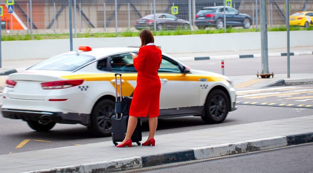 Selective focus. The Female flight attendant leave a hotel en route to the airport