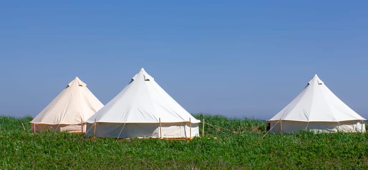 The Glamping house in the nature. Blue sky fnd green grass.