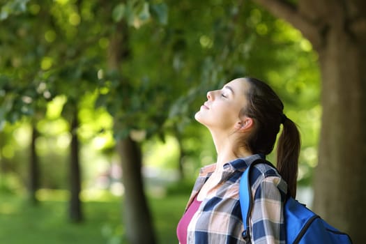 Student breathing fresh air in a campus or park