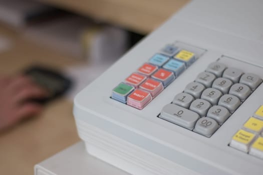 Cash register in a shop: Customer is paying purchase