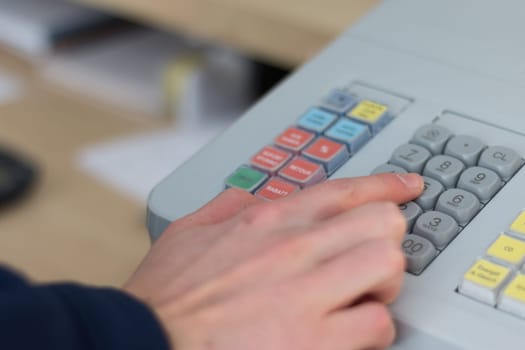 Cash register in a shop: Customer is paying purchase