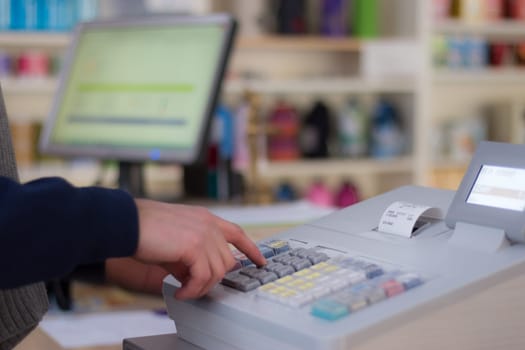 Cash register in a shop: Customer is paying purchase