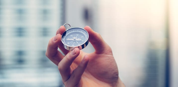 Young freelancer with compass holding in hand, cutout
