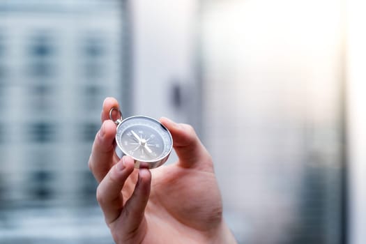 Young freelancer with compass holding in hand, cutout