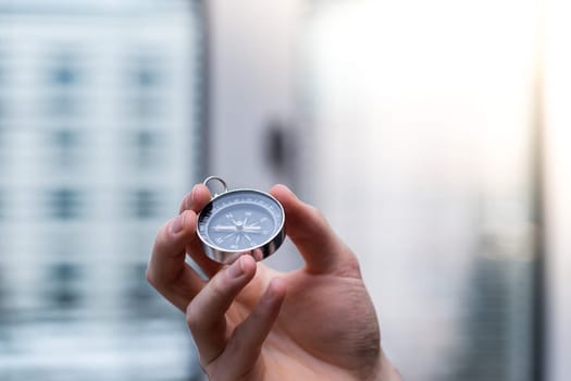Young freelancer with compass holding in hand, cutout
