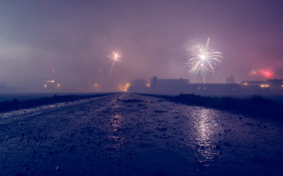 Firework at new year on a dusty wet landscape, Austria