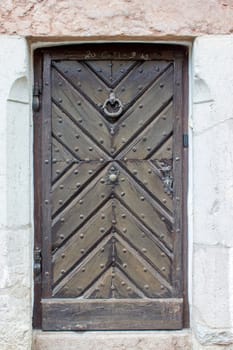 Old vintage wooden door in Hallstatt in Austria