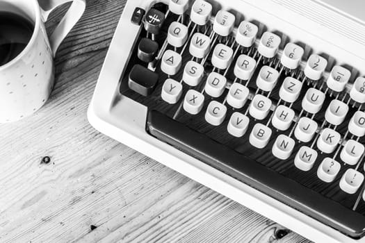 Vintage typewriter on a wooden desk, cutout