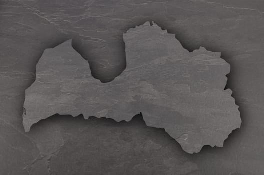 Map of Latvia on dark slate