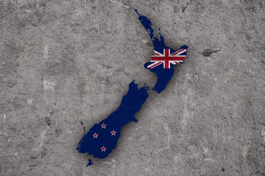 Map and flag of New Zealand on weathered concrete