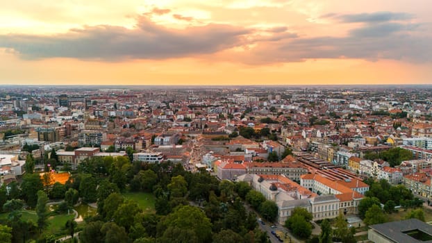 Aerial view of Novi Sad Serbia with sunset sky urban skyline and green park landscape