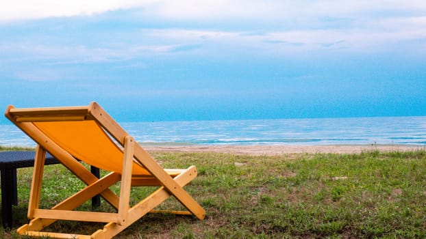 Empty deck chair .Beautiful color chairs on the beach. Blue sky relax happy vacation holiday.