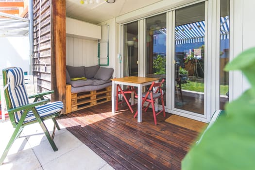 Cozy veranda with little green garden, summer time