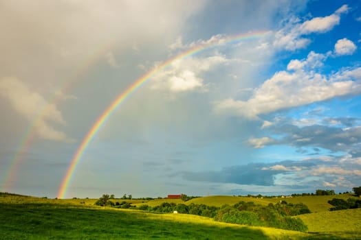 Scenic view of Central Kentucky countryside with double rainbow after storm