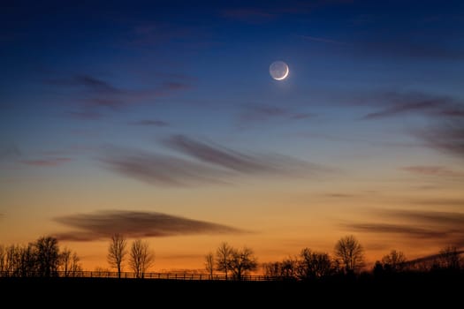 Scenic view of young crescent moon over rural Kentucky