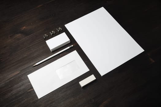Blank stationery set on wood table background. Corporate identity template. Responsive design mockup.
