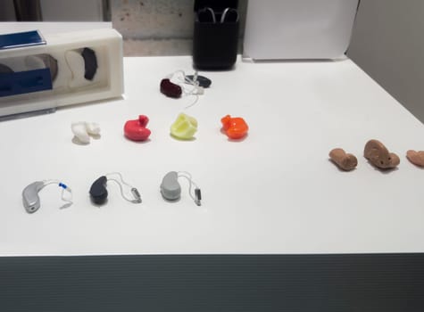 Modern Hearing aid devices displayed at shop. Closeup