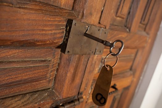 Rural room key lock with hanging tag. Rural tourism concept