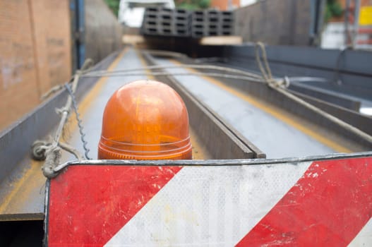 Building materials truck loaded with steel beams. Oversize load length restrictions concept