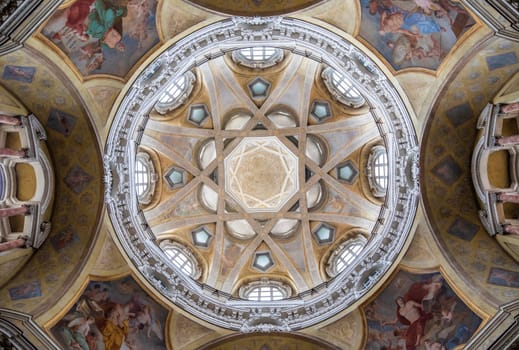 TURIN, ITALY - CIRCA MAY 2021: Antique baroque interior with vintage decoration. Royal Church of San Lorenzo (St. Lawrence).