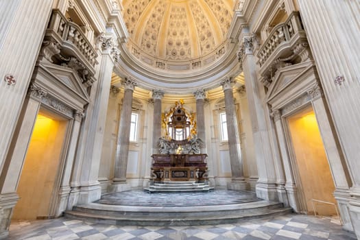 VENARIA REALE, ITALY - CIRCA MAY 2021: sacred catholic altar in Baroque style and cupola. Day light.