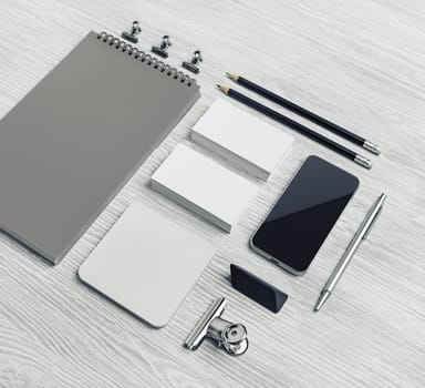 Photo of blank stationery set on light wooden background. Corporate identity mockup. Responsive design template.