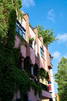 Facade of the Hundertwasserhaus, called "gruene Zitadelle"" in the city center of Magdeburg in Germany"