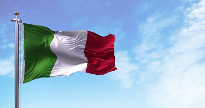 The national flag of Italy flying in the wind. Outdoors and sky in the background. Democracy and independence. European state