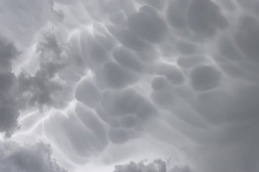 Mammatus storm clouds. Mammatus thunder clouds making an ideal stormy background.
