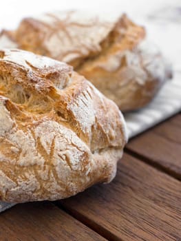 Freshly baked sourdough bread with a golden crust. Round bread close-up.