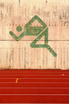 running track and a logo on the wall.