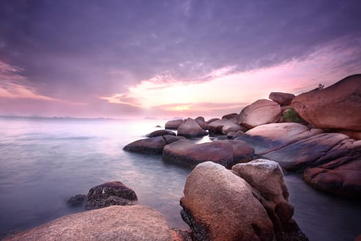 Sea stones at sunset in hong kong.