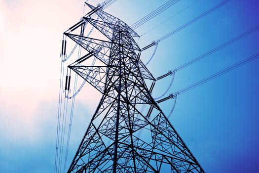 Electricity pylons with long cable at day