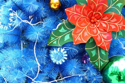 blue christmas background with balls and flower
