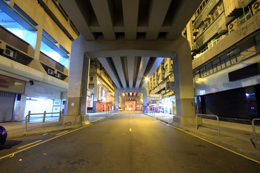 traffic in downtown at night under the bridge