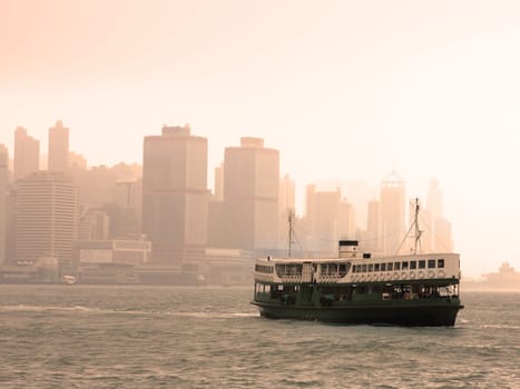 Famous landmark of Hong Kong ferry sailing on Victoria Harbor, Asia.
