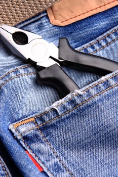 pliers in the jeans' pocket