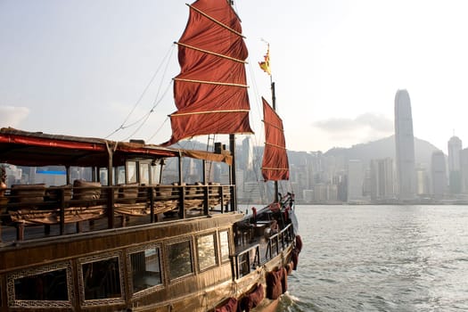 Traditional Chinese Boat on Victoria Harbour, Hong Kong at day