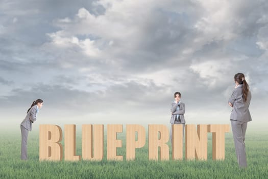 Concept of strategy, plan, idea etc with 3d wooden text and businesswoman under copyspace sky. The Asian woman is the same one.