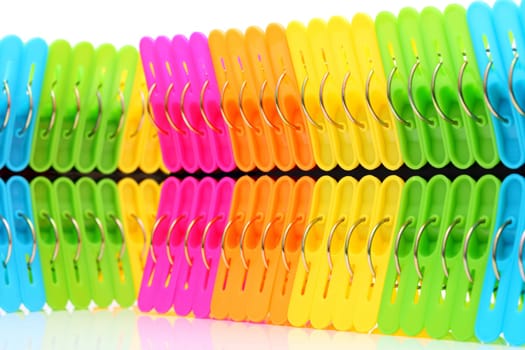 Colorful plastic clothespin on white background
