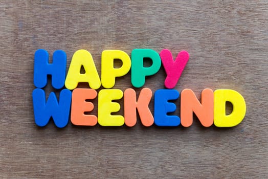 happy weekend words in wood background